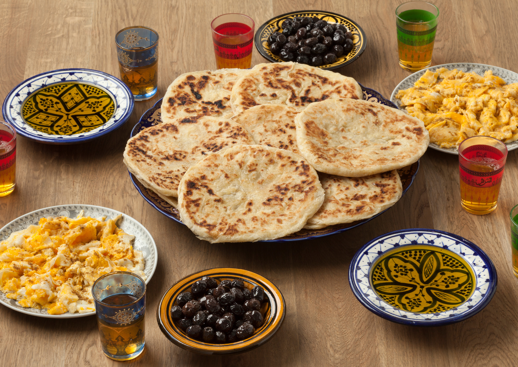 Traditional Breakfast in Morocco - Moroccan bread like Msemman, blacn olives and tea, typical moroccan breakfast, best breakfast in morocco, moroccan breakfast, breakfast in morocco, traditional moroccan breakfast, moroccan breakfast foods