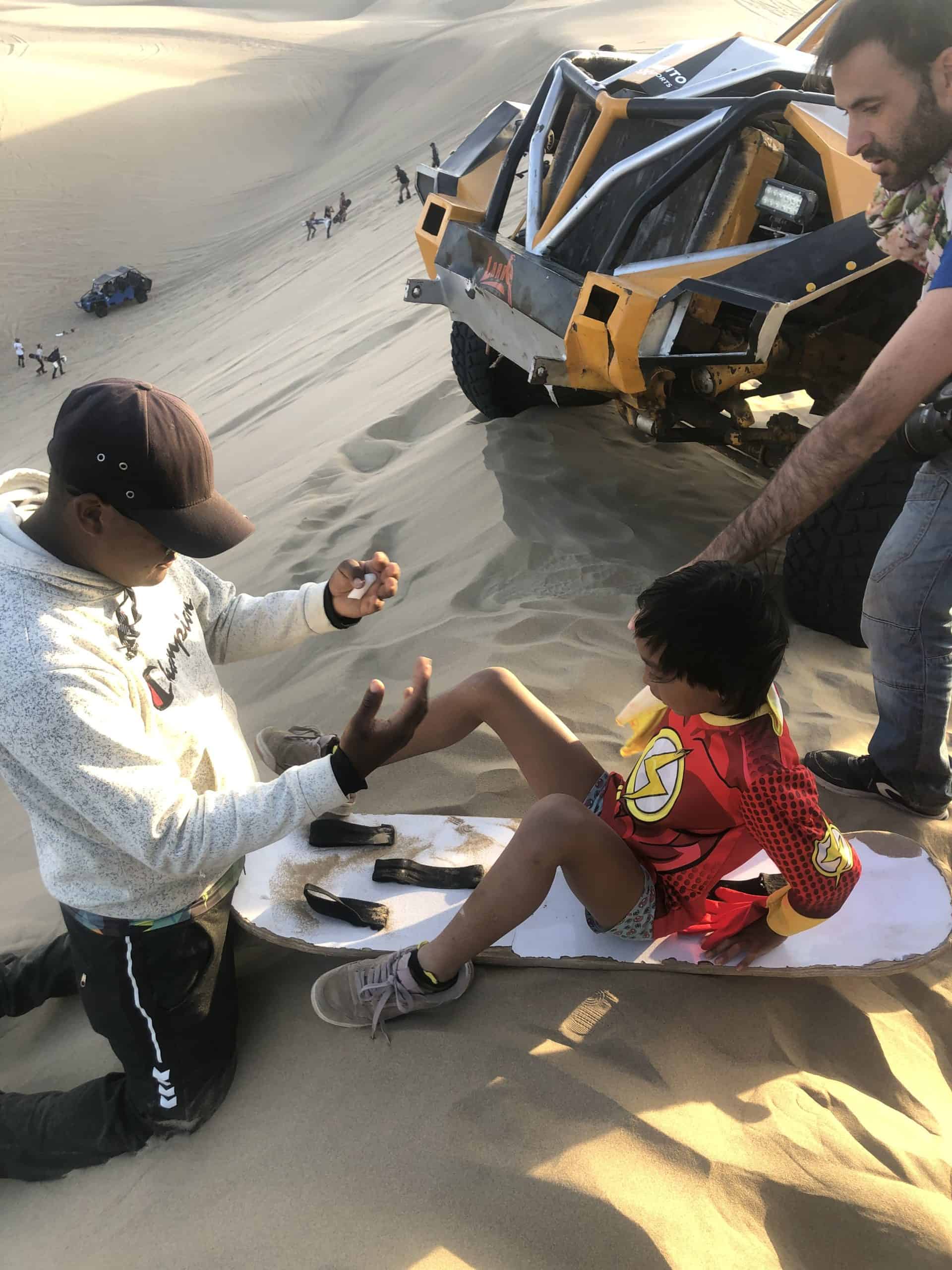 Our little one enjoying sandboarding in Peru - South America Family Vacation / Family Vacations in South America