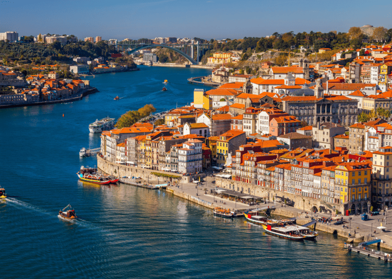14 Dreamy European Cities Where You Can Live Comfortably for Under $2,000 a Month (Yes, Really) 6 8 Best Places for Living in Europe for Less Than $2,000 USD, 10 Bucket List Destinations In Portugal To Visit, 1 Day in Porto Itinerary - One Day in Porto Itinerary - Porto, Portugal old town on the Douro River