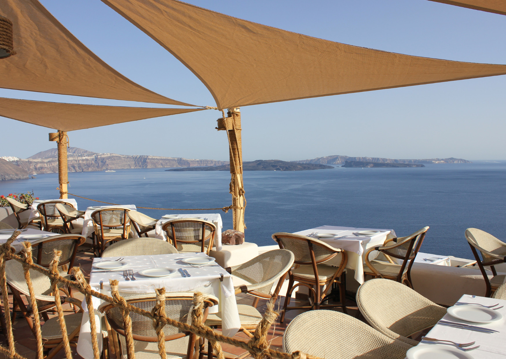 Greek Restaurant with Santorini Beach View - Avoid These 10 Biggest Mistakes Tourists Do in Santorini